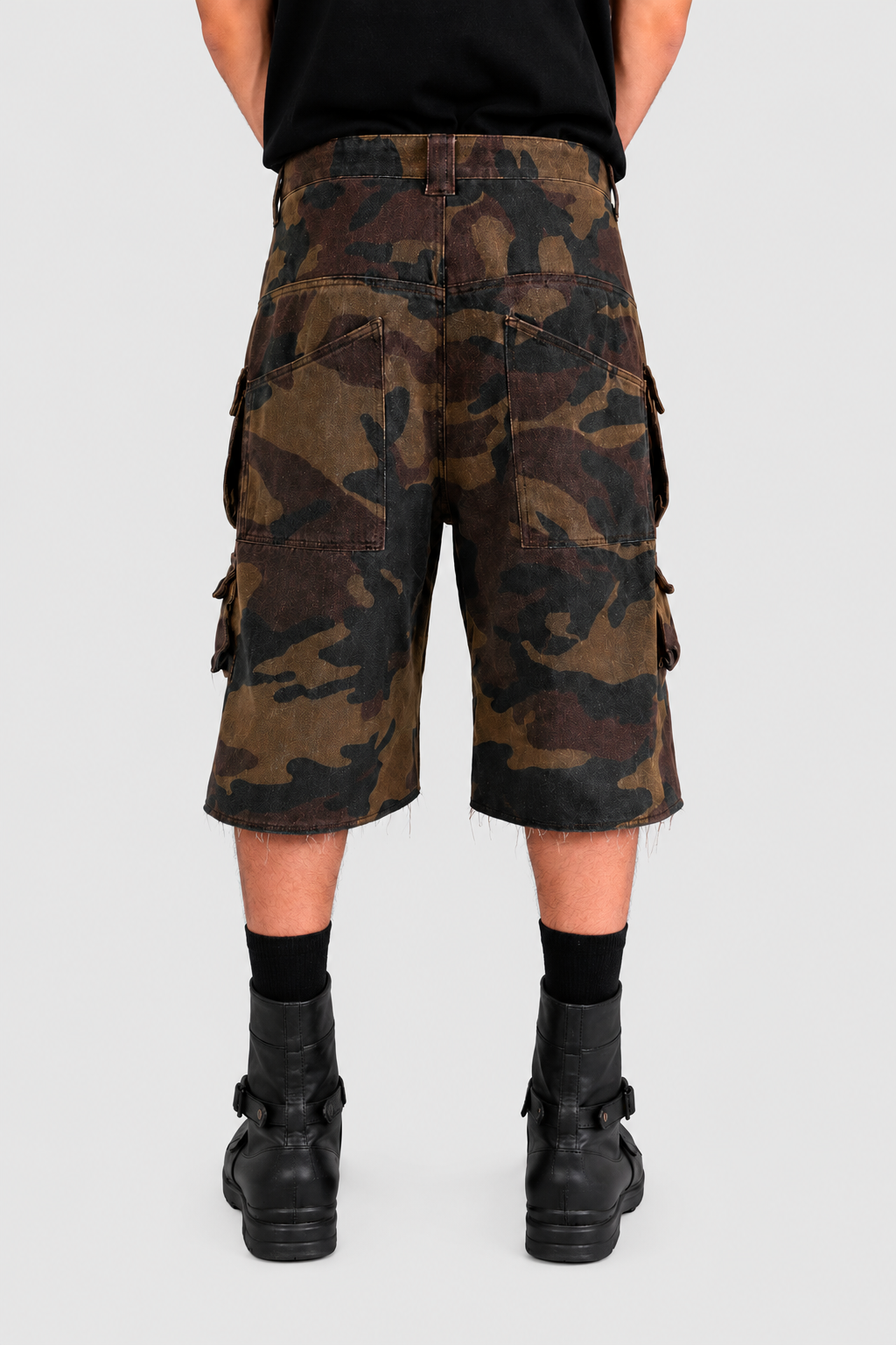 German Wasteland Camouflage Cargo Shorts product gallery image 2 showing the baggy knee-length cargo cut, washed camouflage fabric, utility pockets and summer streetwear styling